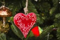 Hanging Christmas ornaments on tree