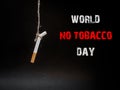 Hanging cigarete on black background. kill yourself. Quitting s Royalty Free Stock Photo