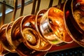 Hanging copper pots, pans, saucepans Royalty Free Stock Photo