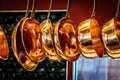 Hanging copper pots, pans, saucepans Royalty Free Stock Photo