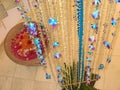 Hanging curtain made from ornate transparent beads and colorful orchid flowers hanging in rows , Party, celebration and festive Royalty Free Stock Photo