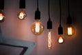 Hanging edison light bulbs on black strings Royalty Free Stock Photo