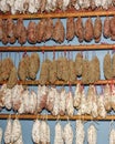 Hanging Esel salami in showcase. French national dish Royalty Free Stock Photo