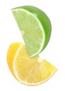 Hanging, falling, flying cutting piece of lemon and lime fruits isolated on white with clipping path