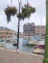 Hanging flower baskets overlooking boat harbour