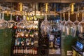 Hanging Glasses in a Bar with Bottles of Royalty Free Stock Photo