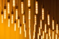 Hanging glowing lamps on a yellow background.