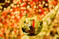 Hanging Golden Christmas Ball On Bokeh Blurred