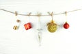 Golden and red christmas decoration over white wooden background.