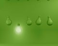 Hanging green light bulbs with glowing one different idea on pastel green background. Minimal concept. top view. Royalty Free Stock Photo