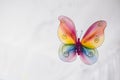 Hanging handmade butterfly in rainbow colors for venue decor or ornament