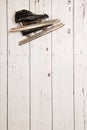 Hanging ice skates on wooden wall Royalty Free Stock Photo