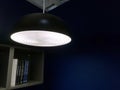 Hanging Illuminated Lamp in Dark Blue Room