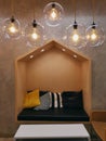 Hanging Illuminated Light Bulbs in Glass Covers in Living Room