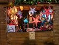 Illuminated Christmas star decorations for sale at the 2019 Christmas Market in the city of York, UK