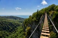 Hanging ladder over a precipice in the mountains, copy space.