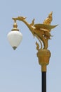 Hanging lamp with black pole and sky background