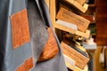 A hanging leather item and wooden boxes displaying Harry Potter themed items at a market stall in Camden Market Royalty Free Stock Photo