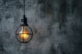 Hanging lightbulb industrial concept on cement background design Royalty Free Stock Photo