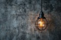 Hanging lightbulb industrial concept on cement background design Royalty Free Stock Photo