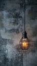 Hanging lightbulb industrial concept on cement background design Royalty Free Stock Photo