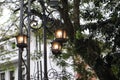The hanging lights on the main road are still on even though it is still daytime Royalty Free Stock Photo