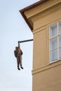 Hanging man sculpture in Prague