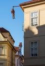 Hanging man sculpture in Prague