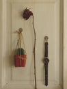 Hanging Mini Cactus, Dry Rose and Vintage Leather Watch on White Wooden Door Royalty Free Stock Photo