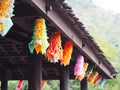 Hanging mobile paper under wooden roof in Thailand.