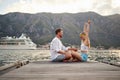 Hanging out at the lake.Romantic holiday. loving couple sitting together on lake bank and enjoying Royalty Free Stock Photo