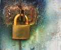 Hanging padlock is locked and hanging on cell rusted old garage door. Concept of secret confidential information Royalty Free Stock Photo