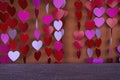 Hanging paper heart mobiles with dark brown board