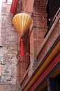 Hanging Paper Lantern and a String of Red Lights in Chinatown Royalty Free Stock Photo