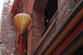 Hanging Paper Lantern and a String of Red Lights in Chinatown Royalty Free Stock Photo