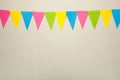 Hanging party flags on white background, decorate items for festival, celebrate event Royalty Free Stock Photo