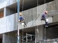 Hanging plasterers Royalty Free Stock Photo