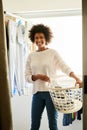 Hanging, portrait and black woman with a laundry basket or smile, housekeeping and wet clothes at home. Face, female Royalty Free Stock Photo