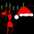 Hanging red underwear and Santa Claus hat on clothesline Royalty Free Stock Photo