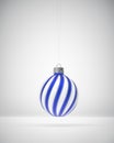 Hanging royal blue and white twisted striped Christmas ball