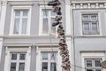 Hanging shoes at a wire in the old town of Flensburg in northern Germany Royalty Free Stock Photo