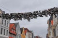 Hanging shoes at a wire in the old town of Flensburg in northern Germany Royalty Free Stock Photo