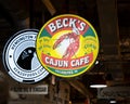 The hanging sign for BeckÃ¢â¬â¢s Cajun Cafe in the historic Reading Terminal Market, an