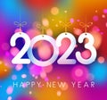 Hanging 2023 sign on colorful background