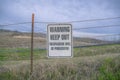 Hanging sign with Warning Keep Out Trespassers Will Be Prosecuted on a trail- San Clemente, CA Royalty Free Stock Photo