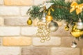 Hanging snowman decoration on the Christmas tree. Gold and silver baubles, multi-colored bows, animals, bells, lit garlands Royalty Free Stock Photo