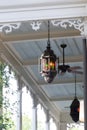 Hanging stained glass lanterns on a Victorian house porch ceiling Royalty Free Stock Photo