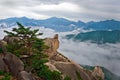 Hanging stone at the Ulsanbawi Rock against the fog seorak mount