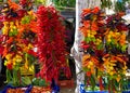 Hanging strings of mixed hot chili peppers for sale at Sineu market, Majorca, Spain