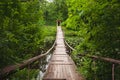 Hanging or suspension bridge in the forest. Royalty Free Stock Photo